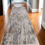 10' Gray Ivory and Gold Abstract Power Loom Runner Rug With Fringe