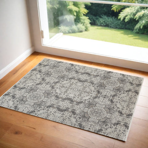 3' X 5' Ivory Taupe and Gray Oriental Power Loom Area Rug With Fringe