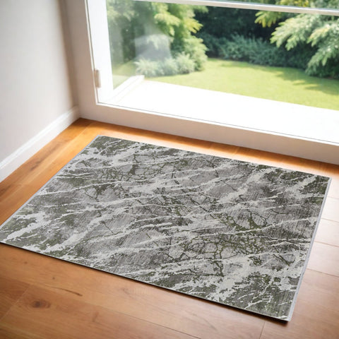 2' X 3' Taupe and Gray Abstract Power Loom Area Rug With Fringe