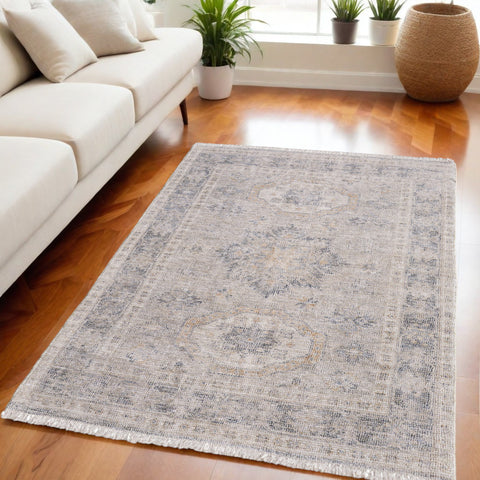 5' X 8' Tan and Gray Oriental Hand Woven Distressed Area Rug With Fringe