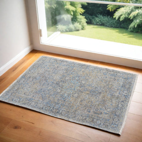 2' X 3' Gray Blue and Tan Abstract Hand Woven Distressed Area Rug With Fringe