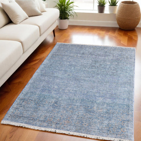 5' X 8' Blue and Gray Abstract Hand Woven Distressed Area Rug With Fringe