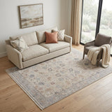 5' X 8' Ivory Tan and Blue Floral Hand Woven Distressed Area Rug With Fringe