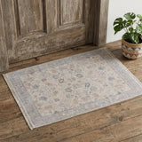 2' X 3' Ivory Tan and Blue Floral Hand Woven Distressed Area Rug With Fringe