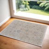 2' X 3' Tan Brown and Blue Floral Hand Woven Distressed Area Rug With Fringe