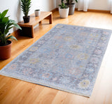 4' X 6' Orange Blue and Gold Floral Hand Woven Distressed Area Rug With Fringe
