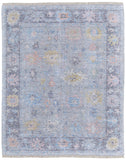 5' X 8' Orange Blue and Gold Floral Hand Woven Distressed Area Rug With Fringe