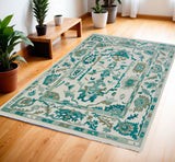 4' X 6' Green and Ivory Wool Floral Hand Knotted Area Rug With Fringe