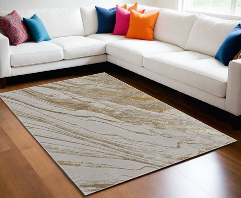 5' X 8' Ivory Brown and Gold Abstract Power Loom Area Rug