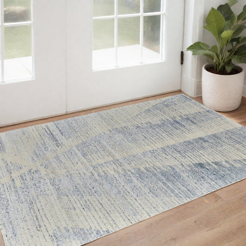3' X 5' Ivory Blue And Silver Abstract Hand Knotted Distressed Area Rug