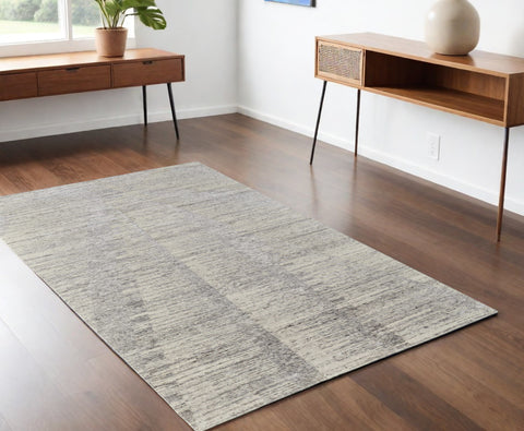 4' X 6' Ivory and Gray Abstract Hand Knotted Worn Faded Area Rug
