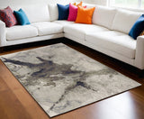 5' X 8' Taupe Brown And Black Abstract Area Rug