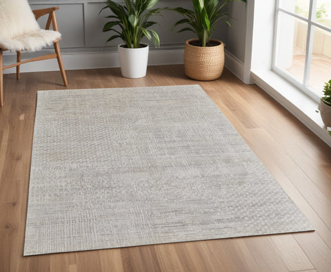 4' X 6' Ivory and Gray Abstract Hand Woven Worn Faded Area Rug