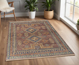 4' X 6' Blue Red and Tan Wool Geometric Hand Knotted Area Rug With Fringe