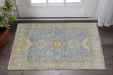 2' X 3' Green Blue and Yellow Wool Geometric Hand Knotted Area Rug With Fringe