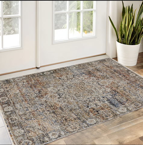 3' X 5' Tan Blue And Burnt Orange Oriental Area Rug With Fringe