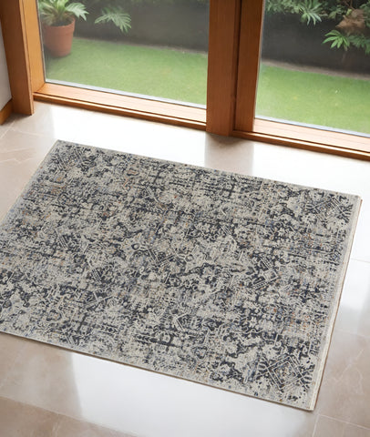 3' X 5' Ivory and Gray Abstract Power Loom Worn Faded Area Rug With Fringe