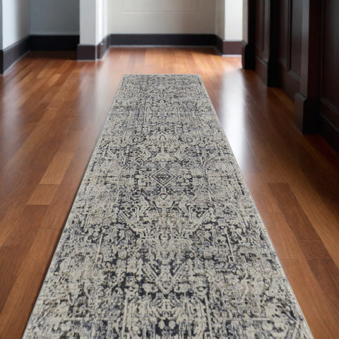 12' Ivory and Gray Abstract Power Loom Worn Faded Runner Rug With Fringe