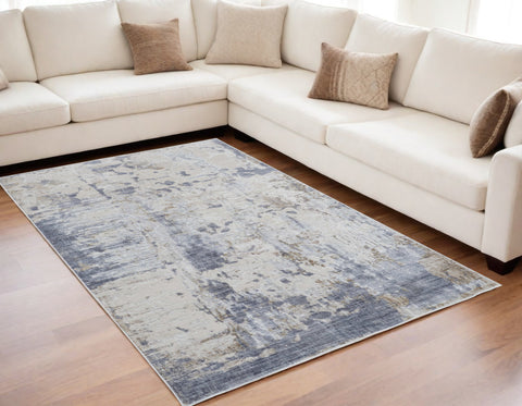 5' X 8' Ivory Gray and Blue Abstract Power Loom Worn Faded Area Rug