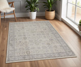 4' X 5' Gray and Ivory Oriental Power Loom Worn Faded Area Rug With Fringe