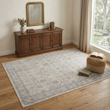 4' X 5' Gray and Ivory Oriental Power Loom Worn Faded Area Rug With Fringe