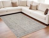 5' X 7' Gray and Ivory Oriental Power Loom Worn Faded Area Rug With Fringe