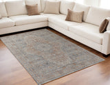 5' X 7' Gray Ivory and Orange Oriental Power Loom Worn Faded Area Rug With Fringe
