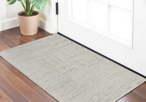 2' X 3' Gray and Ivory Abstract Hand Woven Worn Faded Area Rug
