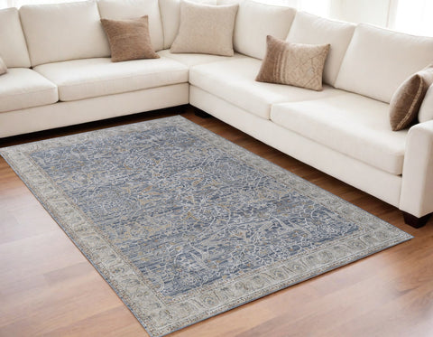 5' X 8' Taupe and Blue Ikat Power Loom Worn Faded Area Rug With Fringe