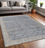 5' X 8' Blue Taupe And Ivory Ikat Distressed Area Rug With Fringe