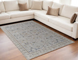 5' X 8' Ivory Blue And Taupe Ikat Distressed Area Rug With Fringe