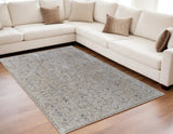 5' X 8' Ivory Taupe and Blue Abstract Power Loom Worn Faded Area Rug With Fringe