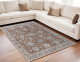 5' X 8' Red Blue and Ivory Floral Power Loom Worn Faded Area Rug With Fringe