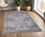 4' X 6' Gray and Ivory Oriental Power Loom Worn Faded Washable Area Rug