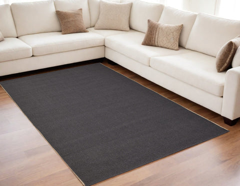 5' X 8' Tan and Gray Hand Woven Area Rug