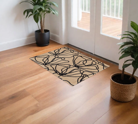 2' X 4' Beige And Black Floral Washable Area Rug With UV Protection