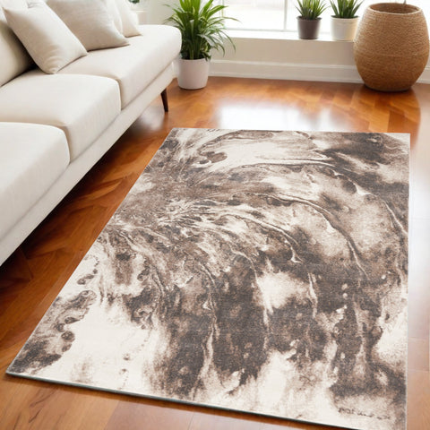 5' X 7' Tan Abstract Power Loom Area Rug
