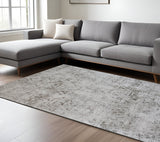 5' X 8' Cream and Beige Abstract Area Rug