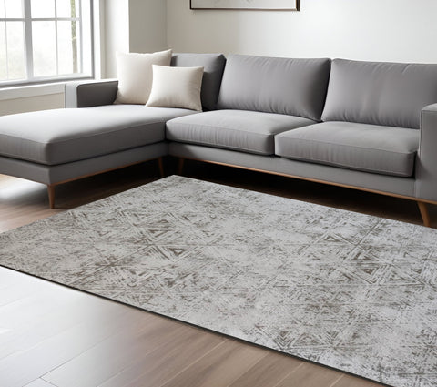 5' X 8' Cream and Beige Abstract Area Rug