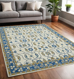 5' X 8' Blue Beige And Brown Wool Oriental Hand Hooked Area Rug