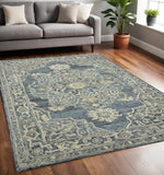 5' X 7' Denim Blue And Ivory Wool Oriental Hand Tufted Area Rug