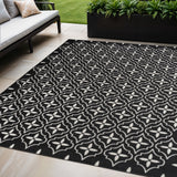 5' X 7' Black And Ivory Geometric Indoor Outdoor Area Rug