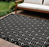 6' X 9' Black And Ivory Geometric Indoor Outdoor Area Rug