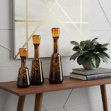 Set of Three Amber Abstract Swirl Glass Decorative Bottles With Stoppers