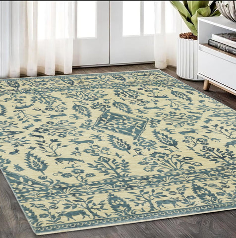 5' X 8' Ivory And Blue Oriental Area Rug With Fringe
