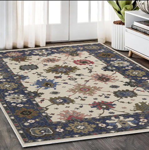 5' X 8' Blue And Ivory Floral Area Rug With Fringe