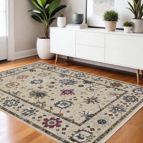 4' X 6' Ivory Blue And Light Brown Floral Area Rug With Fringe
