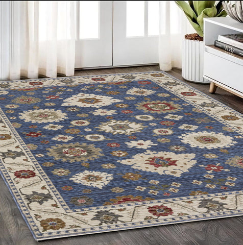 5' X 8' Blue And Ivory Floral Area Rug With Fringe