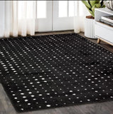 5' X 8' Black And Ivory Geometric Area Rug