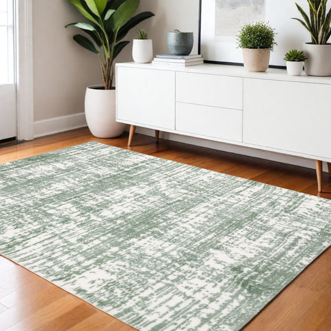 4' X 6' Green And Ivory Abstract Area Rug